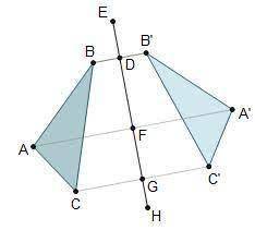 The image of ΔABC after a reflection across Line E G is ΔA'B'C'. 2 triangles are shown. A line of re