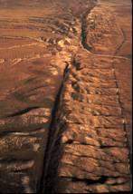 The image is an aerial photograph. what is the geological feature shown?  a) a large fault on