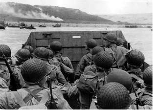 The photograph below was taken in 1944: photograph from the normandy invasion, june 1944, showing h