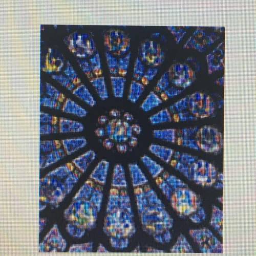 What type of stained glass window is this? A.pointed arch B.rounded arch C.rose D.compass