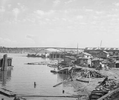 PLZZ HELP I IS TIIMED Study this 1936 photograph of laborers’ waterfront shacks in Portland, Oregon.