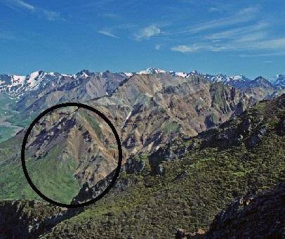 The image shows mountains in Alaska.

Which describes the circled area of these mountains? 
A sync