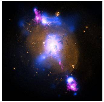 Look at this NASA picture of a giant black hole and read the paragraph.

Credit: X-ray: NASA/CXC/S