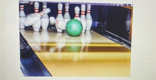 The image below depicts a bowling ball traveling down the lane and striking pins, knocking them dow