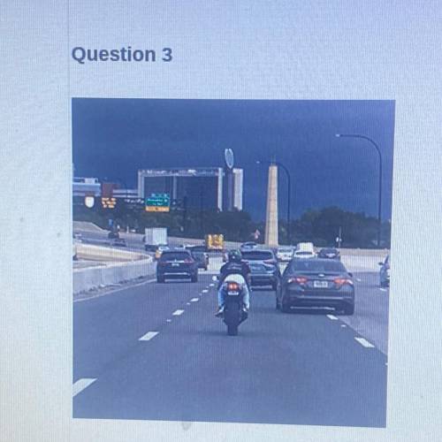 A What hazards might this motorcyclist encounter?

B. What precautions should be taken by a driver